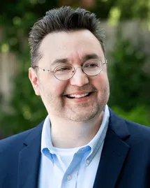 outpatient-alcohol-treatment-medical-director-dr-christopher-lord Dr. Christopher E. Lord, Medical Director for outpatient alcohol treatment, smiling in business attire.