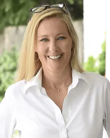 outpatient-rehab-charlotte-nc-chief-operating-officer-tammy-hanson Tammy Hanson, Chief Operating Officer at an outpatient rehab in Charlotte NC, smiling in a white shirt.