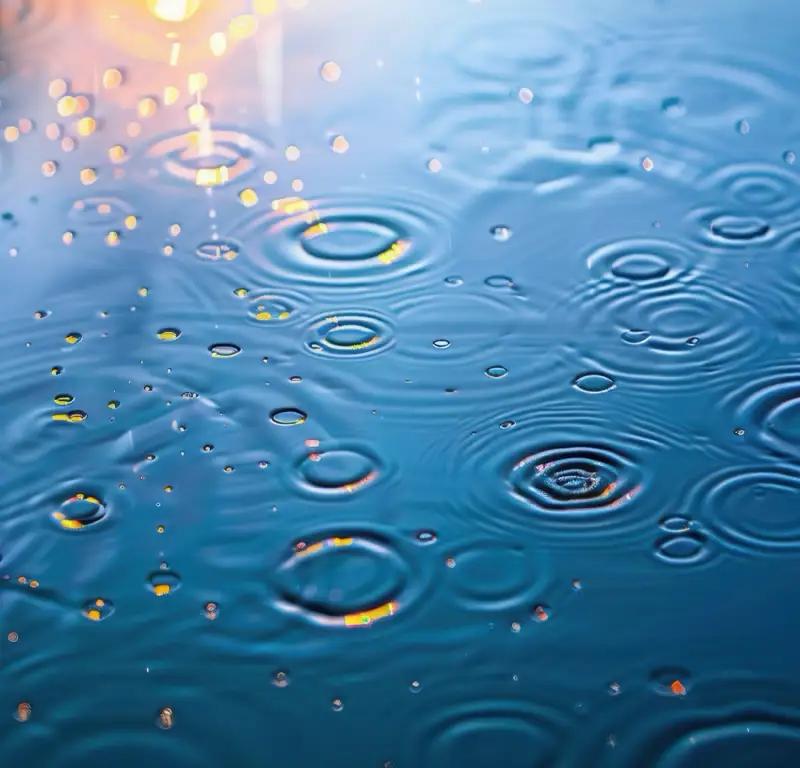 aa-steps-benefits-of-stopping-drinking-alcohol-detox-recovery Close-up of water ripples with soft reflections, symbolizing the ripple effect of recovery and the benefits of giving up alcohol through the 12 steps of AA.