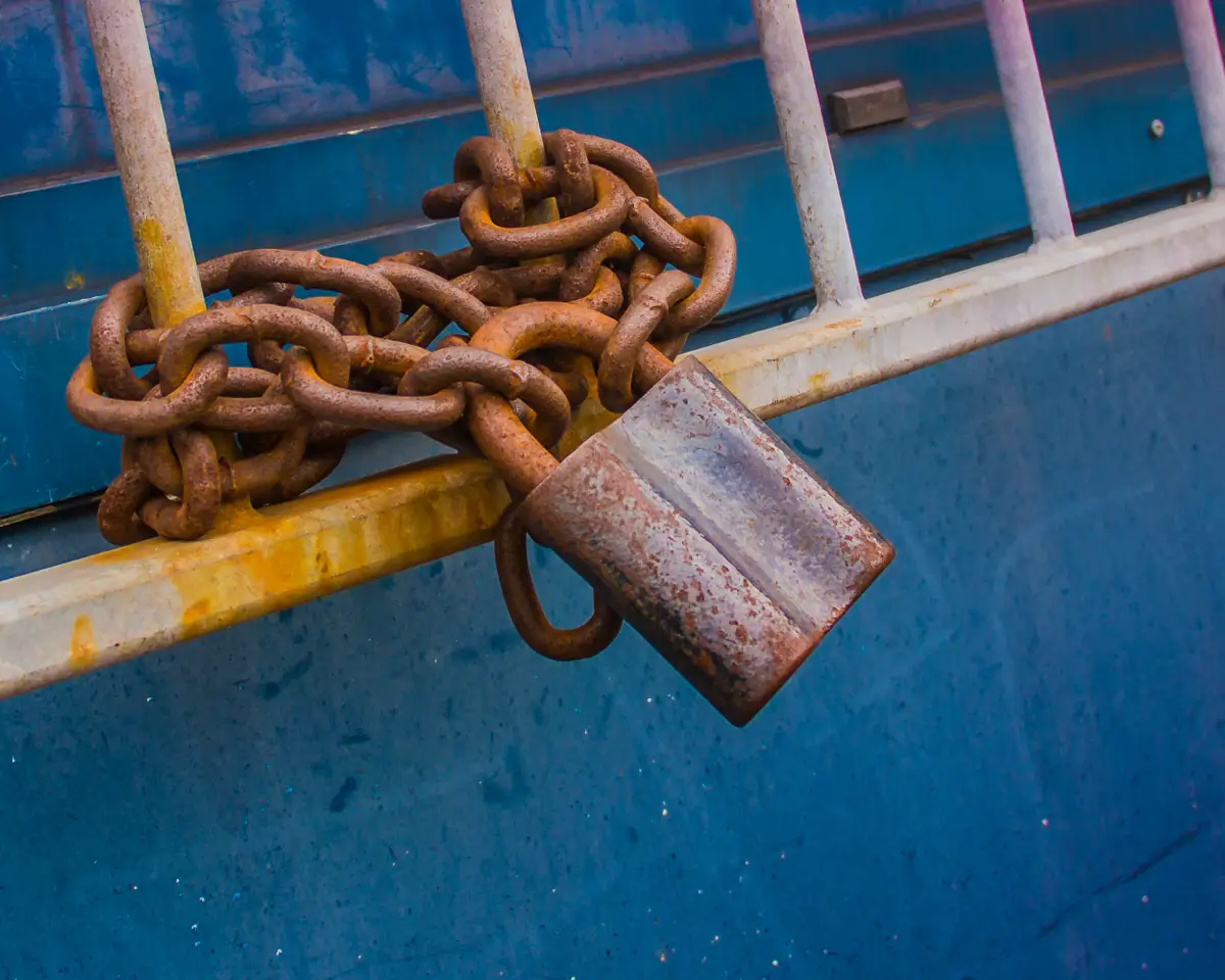 Rusty chain with a padlock, symbolizing the struggle of overcoming fentanyl addiction and seeking treatment.